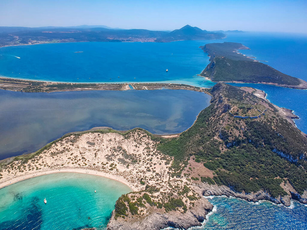 Aerial panorama view of the famous semicircular sandy beach and lagoon of Voidokilia. It is one of the most iconic beaches in Mediterranean sea with crystal clear turquoise water in Messenia, Greece - Photo, Image