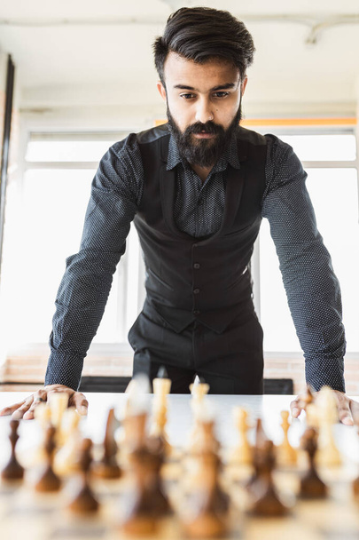planning strategy with chess figures on an old wooden table - 写真・画像
