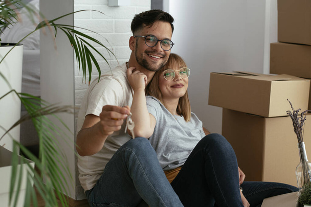 young couple moving in new flat - Photo, Image
