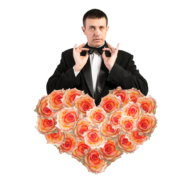 Man in Classical Black Tuxedo with Heart Flower Roses.Love concept.Beautiful Abstract Bouquet Roses.Wedding - Fotó, kép