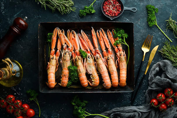 langoustines. raw scampi ready to be cooked in black stone background. Top view. Free copy space. - Photo, Image
