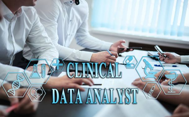Medical healthcare concept - group of doctors in hospital with digital medical icons, graphic banner showing symbol of medicine, providing medical care. The inscription "CLINICAL DATA ANALYST.jpg - Фото, изображение