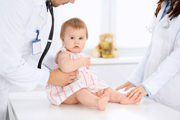 Doctor and patient. Happy cute baby at health exam. Medicine and health care concept - Foto, Bild