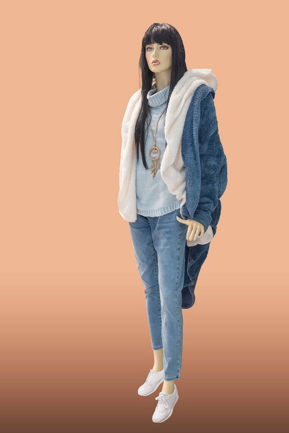 Full length female mannequin dressed in warm fashionable clothes, isolated. No brand names or copyright objects. - Photo, Image
