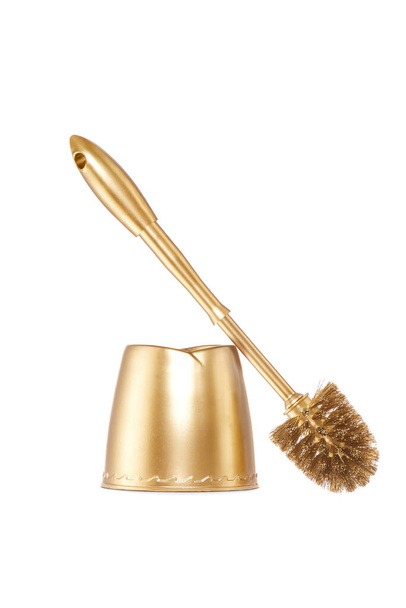 Close up view of gold toilet brush on white back - Photo, Image