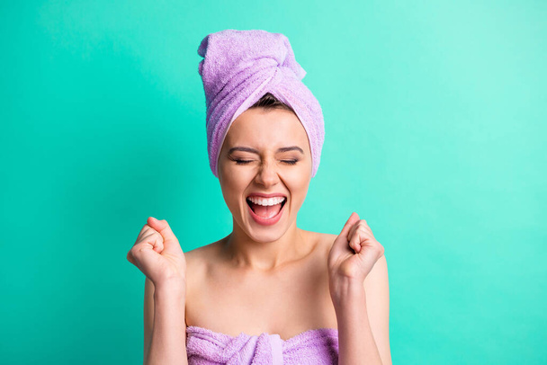 Photo portrait happy surprised woman turban on head rejuvenation in shower shouting with closed eyes isolated vivid teal color background - Foto, immagini