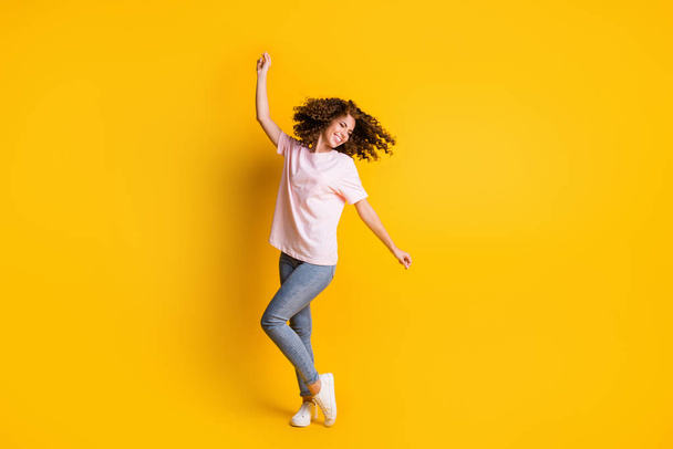 Photo portrait full length of woman dancing isolated on vivid yellow colored background - Foto, Imagen