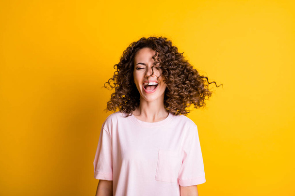 Photo portrait of girl with flying hair open mouth isolated on vivid yellow colored background - Foto, Imagen
