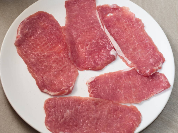 Tendered Raw Pork Slices on White Plate - Zdjęcie, obraz