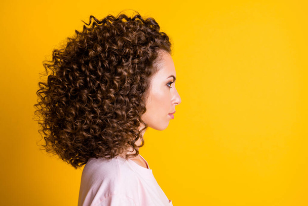 Photo portrait profile of serious woman isolated on vivid yellow colored background - Fotografie, Obrázek