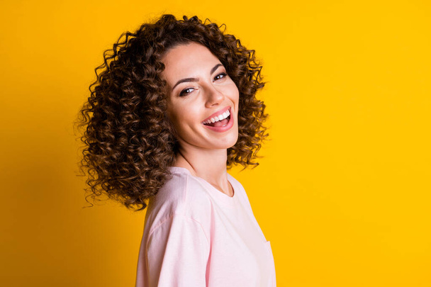 Photo portrait of laughing girl isolated on vivid yellow colored background - Foto, Imagem