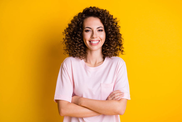 Photo of young attractive confident woman happy smile crossed hands isolated over yellow color background - Fotografie, Obrázek