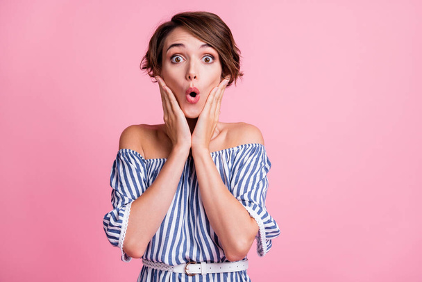 Photo portrait of shocked woman touching face with two hands isolated on pastel pink colored background - Φωτογραφία, εικόνα