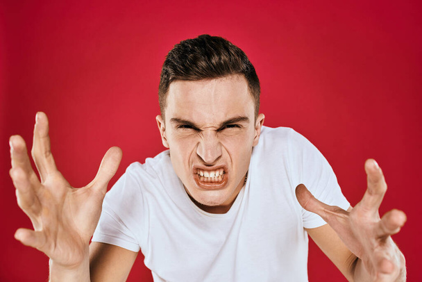Man in white t-shirt emotions displeased facial expression isolated background - Foto, Imagen