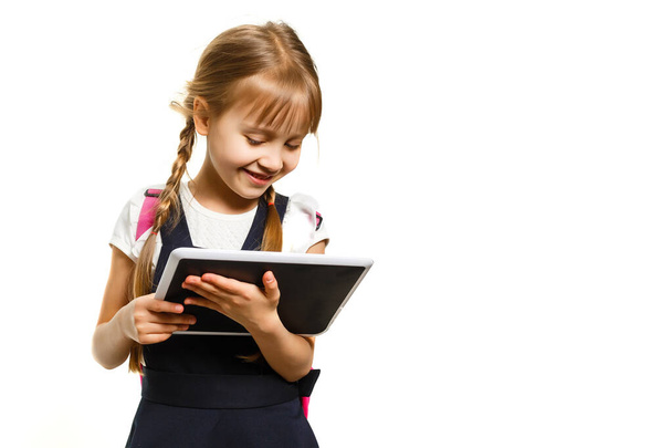 little girl using tablet computer. Isolated on white background. - Photo, image