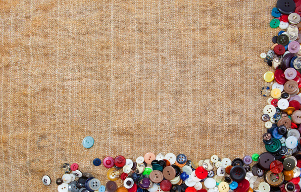Vintage Sewing Buttons Framing Fabric Background - Fotó, kép