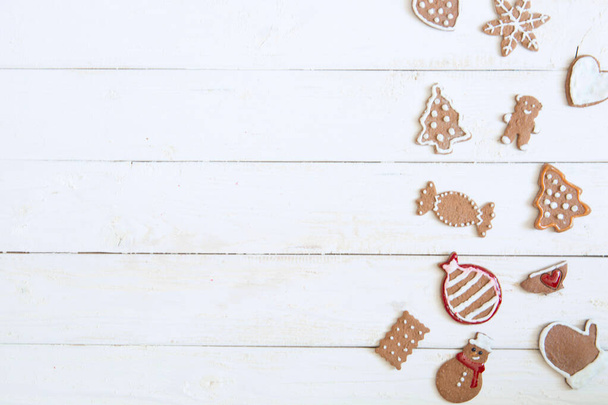 Gingerbread cookie for new year on white wooden background top view copyspace. - 写真・画像