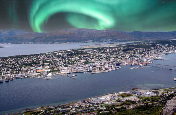 Bodo harbor on a cloudy day in the north of Norway with aurora borealis in the sky. - Photo, Image