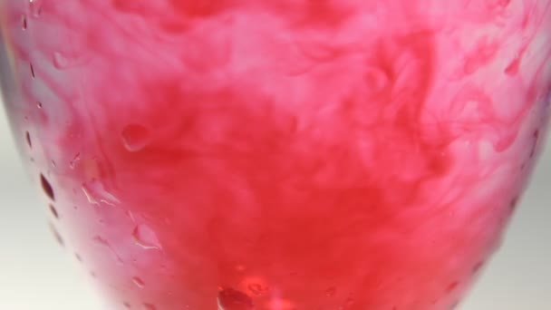 Glass Champagne with water and Liquid Color Flowing .. - Footage, Video