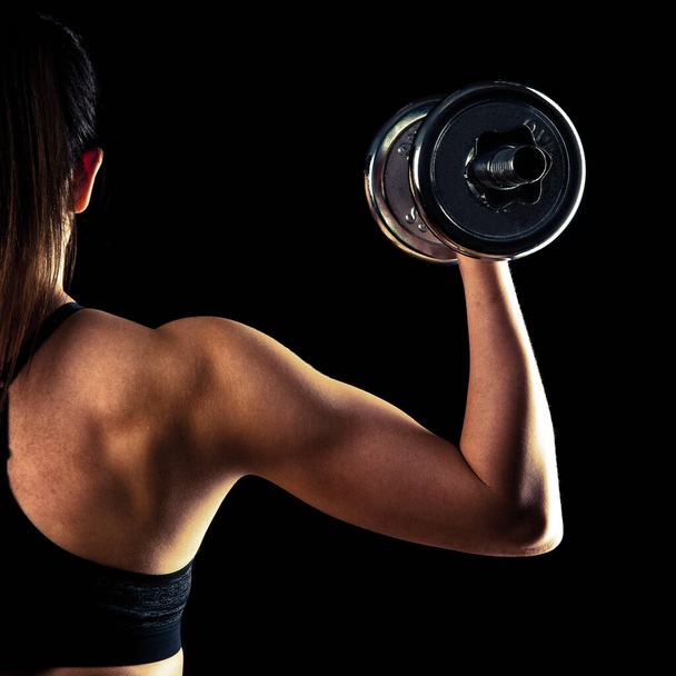 attractive young woman working out with dumbbells - Foto, Imagem