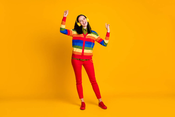 Full body photo of young attractive girl listen music radio headphones enjoy dance isolated over yellow color background - Φωτογραφία, εικόνα