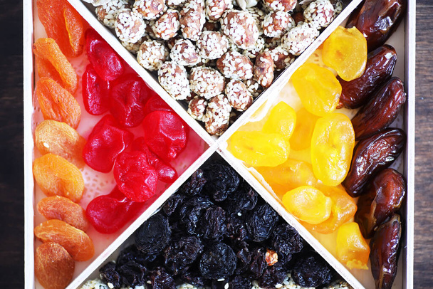 Nuts and dried fruits assortment stone table top view. - Photo, Image