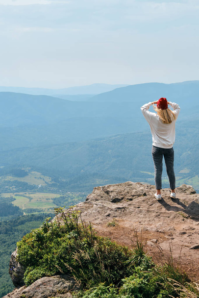 Girl enjoy scenics view on valley. Beautiful nature landscape in mountains. Hiking journey on tourist trail. Outdoor adventure. Travel and exploration. Healthy lifestyle, leisure activities - Foto, Bild