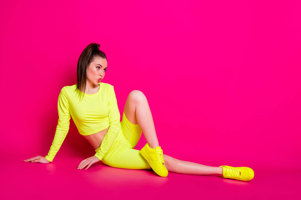 Full length body size photo of girl doing aerobics with pouted lips looking at blank space isolated on bright pink color background - Fotó, kép