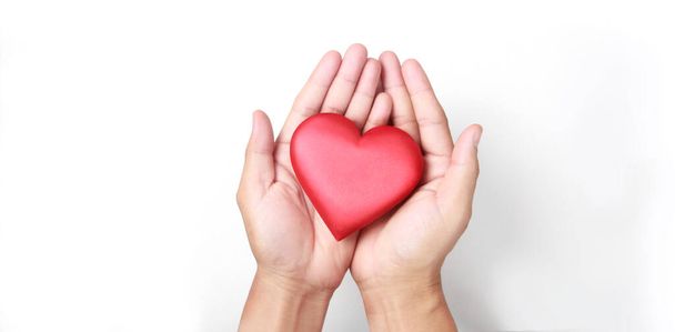 Hands holding a red heart. heart health donation concepts - Photo, Image