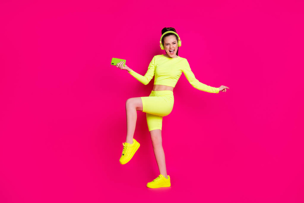 Full length body size view of her she nice attractive slender cheerful cheery girl listening pop music dancing having fun chill isolated bright vivid shine vibrant pink fuchsia color background - Fotografie, Obrázek