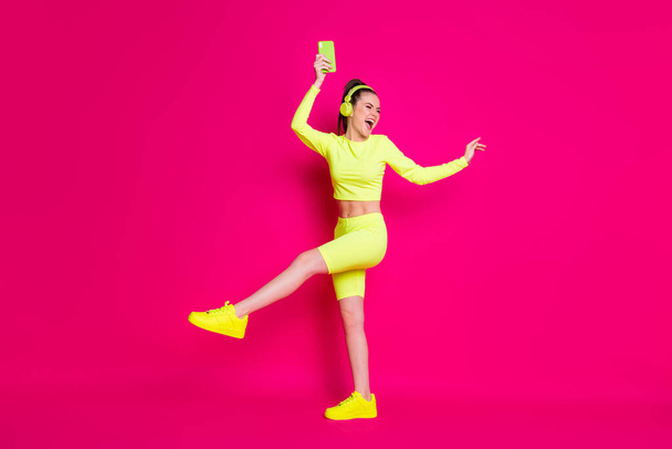 Full length body size view of her she nice attractive slim fit thin cheerful cheery glad girl listening pop music dancing rest chill isolated bright vivid shine vibrant pink fuchsia color background - Φωτογραφία, εικόνα