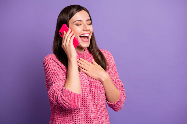 Photo portrait of happy overjoyed girl talking on smartphone laughing hand on chest isolated on bright violet color background - Valokuva, kuva