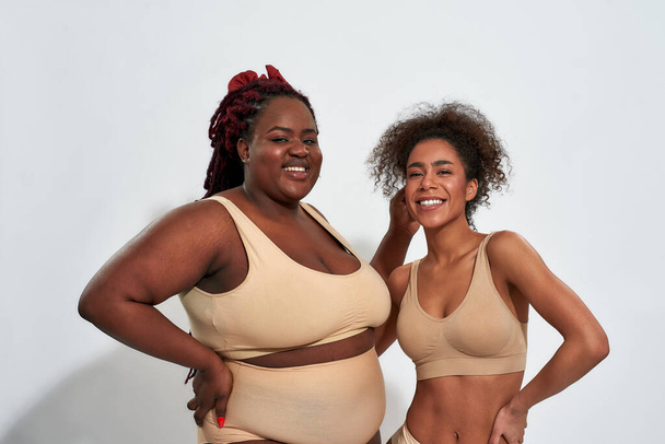 Happy slim and plump young african american women - Фото, зображення