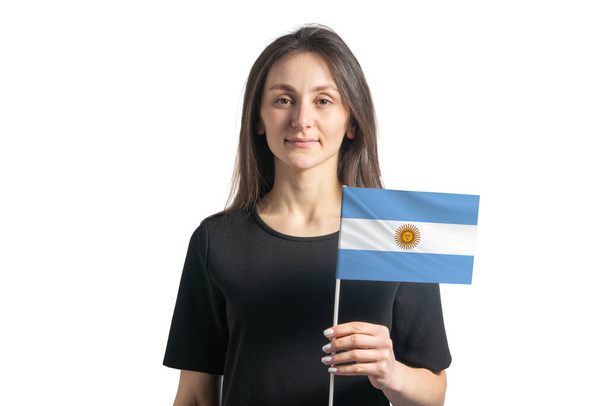 Boldog fiatal fehér lány gazdaság Argentína zászló elszigetelt fehér háttér - Fotó, kép