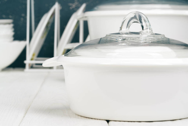 White pot cookware in a kitchen interior - Foto, Imagen