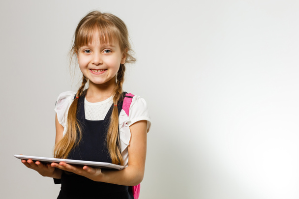 Little Funny girl in shirt. Isolated on white background. Baby girl in school. The child girl with textbooks. Girl studing. - Fotografie, Obrázek