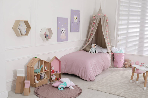 Cute child's room interior with toys and modern furniture - Zdjęcie, obraz