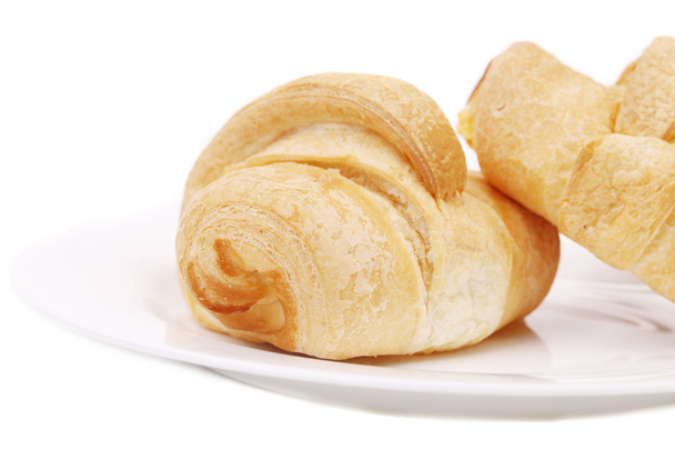 Fresh croissants on white plate - Photo, image