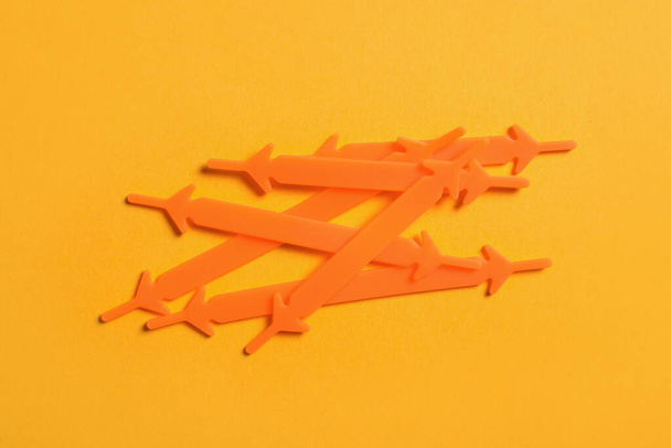 Orange silicone shoelaces on yellow background, flat lay - Zdjęcie, obraz