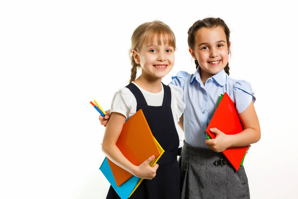Two little schoolgirls. Education, fashion, friendship concept. - Fotografie, Obrázek