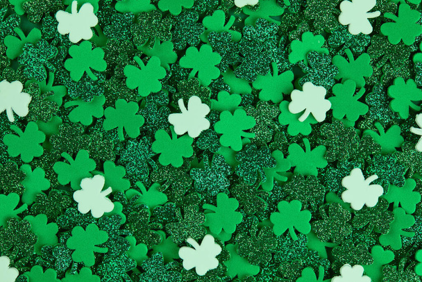 Shamrock confetti texture background with green and white lucky clovers - Photo, Image