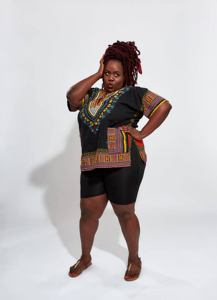 Plus size haitian woman wearing ethnic blouse - Foto, imagen