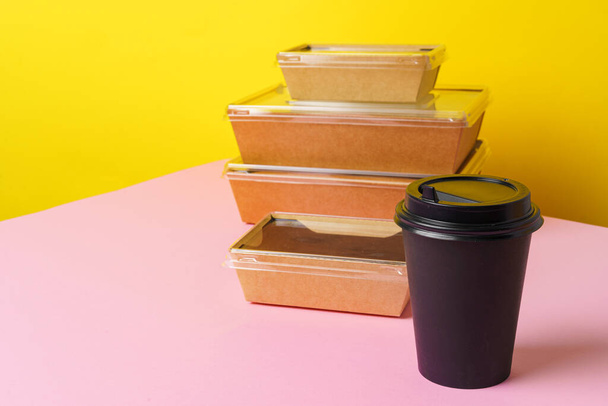Takeaway food concept. Some packed food in container with coffee cup - Foto, afbeelding