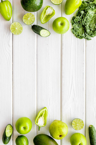 Frame of vegetarian food - green vegetables: cucumbers, broccoli, avocado - Фото, изображение