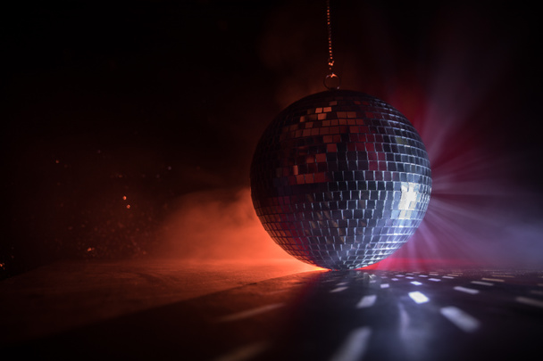 Colorful disco mirror ball lights night club background. Party lights disco ball. Selective focus - Photo, Image