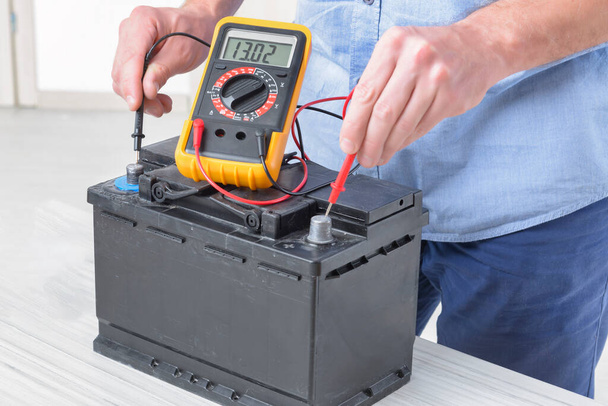 Testing car battery with digital multimeter - Photo, Image