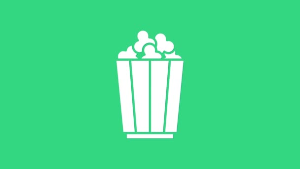 Bílý popcorn v papírové krabici ikona izolované na zeleném pozadí. Kbelík s popcornem. Grafická animace pohybu videa 4K - Záběry, video