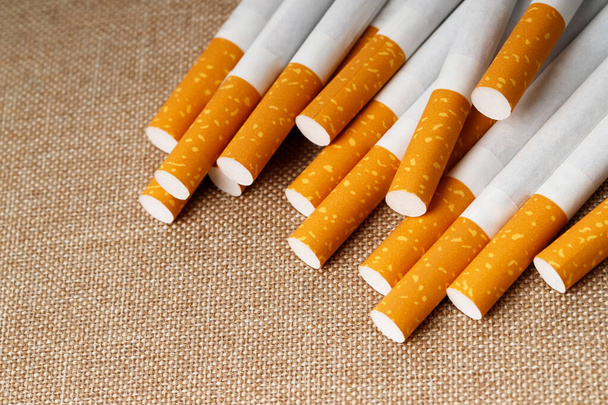 cigarette on a wooden background - Фото, зображення