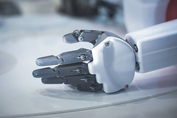 Hydraulic mechanical cyborg robot arm in hand shake gesture, robotized manipulator on  manufacture line - Фото, зображення