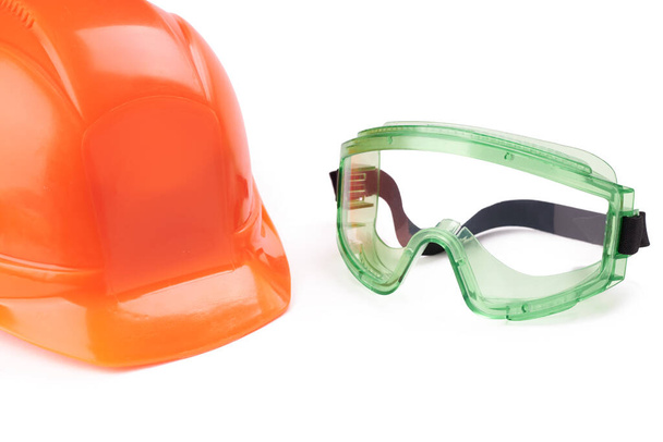 industrial safety glasses and safety helmet. workwear goggles. isolated on a white background - Photo, Image